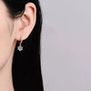 Moissanite drop earrings in rose-gold-plated sterling silver