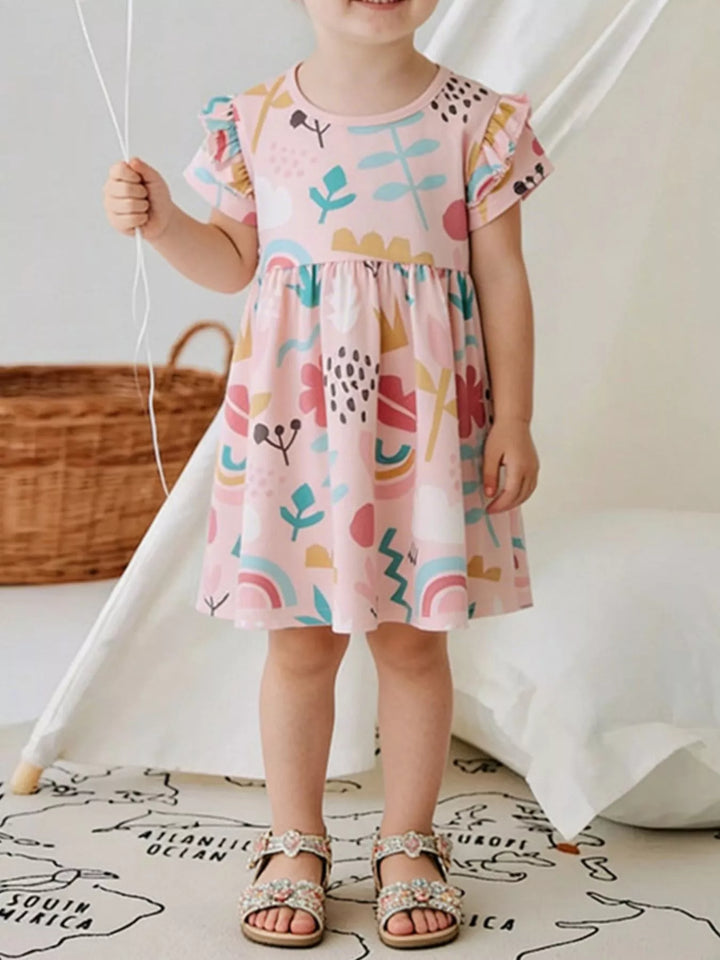 Pale-blush children’s cotton dress with ruffle sleeves and abstract print.