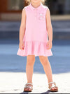Blush-pink sleeveless children’s polo dress with embroidered detail and a ruffled hem.