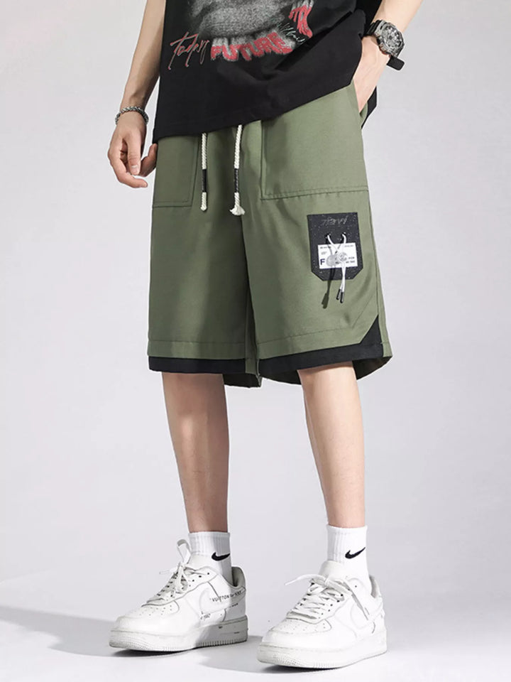 Men's green drawstring cargo shorts with pockets