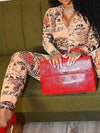 Women's tan printed zip-front long-sleeve jumpsuit