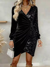 Black velvet sequin wrap mini dress with ruched detail.