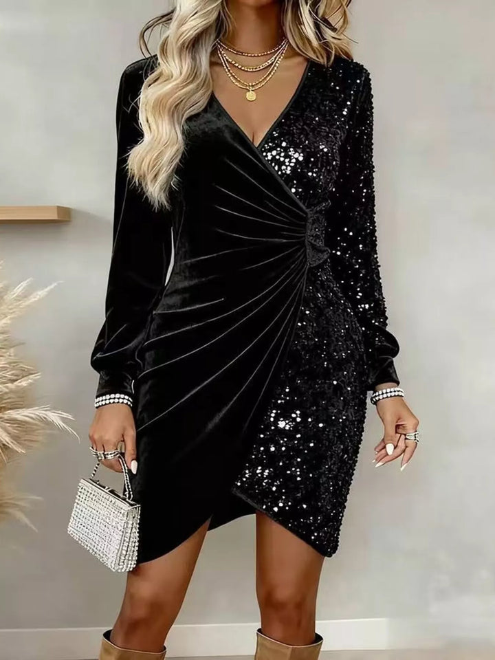 Black velvet sequin wrap mini dress with ruched detail.