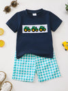 Navy tractor appliqué tee with turquoise gingham shorts for children.