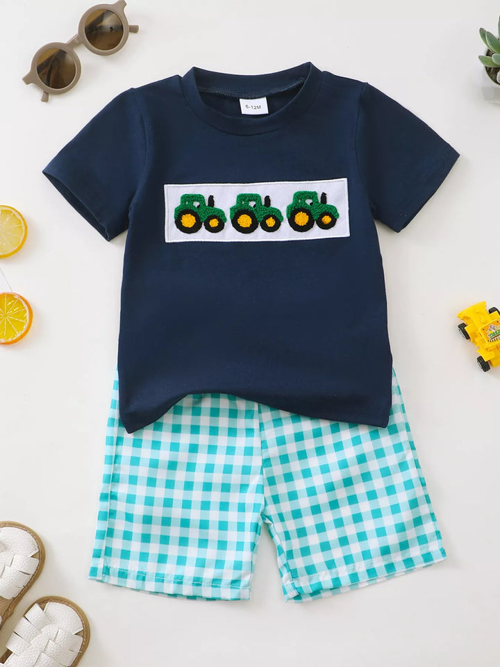Navy tractor appliqué tee with turquoise gingham shorts for children.