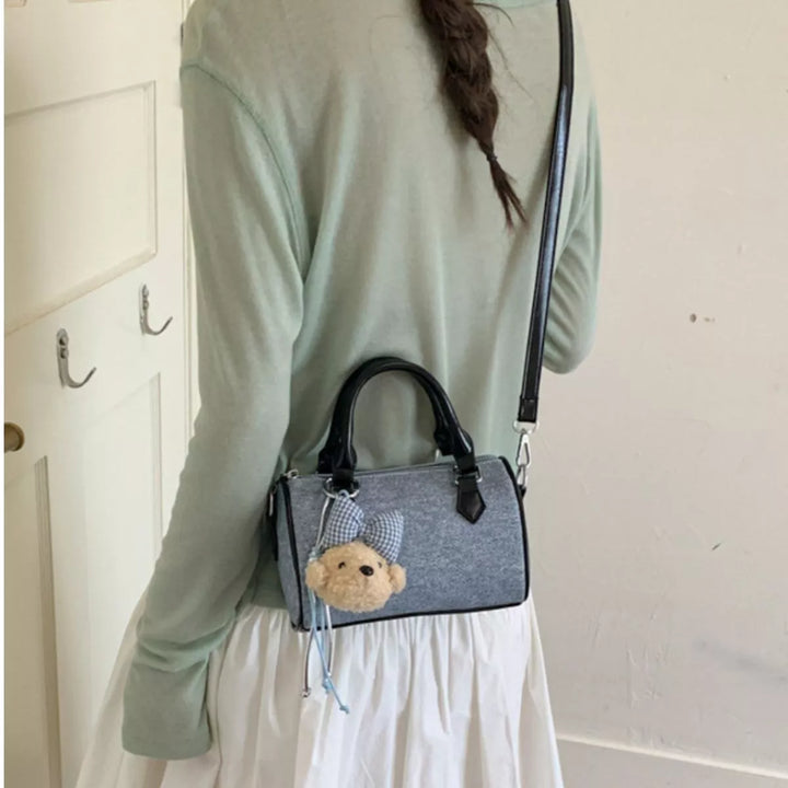 Pastel blue denim barrel crossbody bag