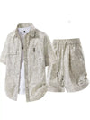 Men’s textured drawstring shirt and shorts set.