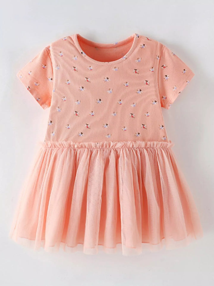 Peach printed tulle-layered children’s dress.