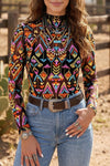 Black abstract-print mesh mock-neck long-sleeve top styled with denim