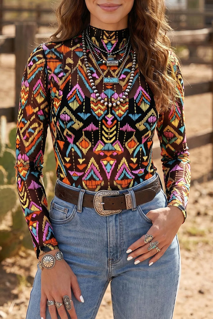 Black abstract-print mesh mock-neck long-sleeve top styled with denim